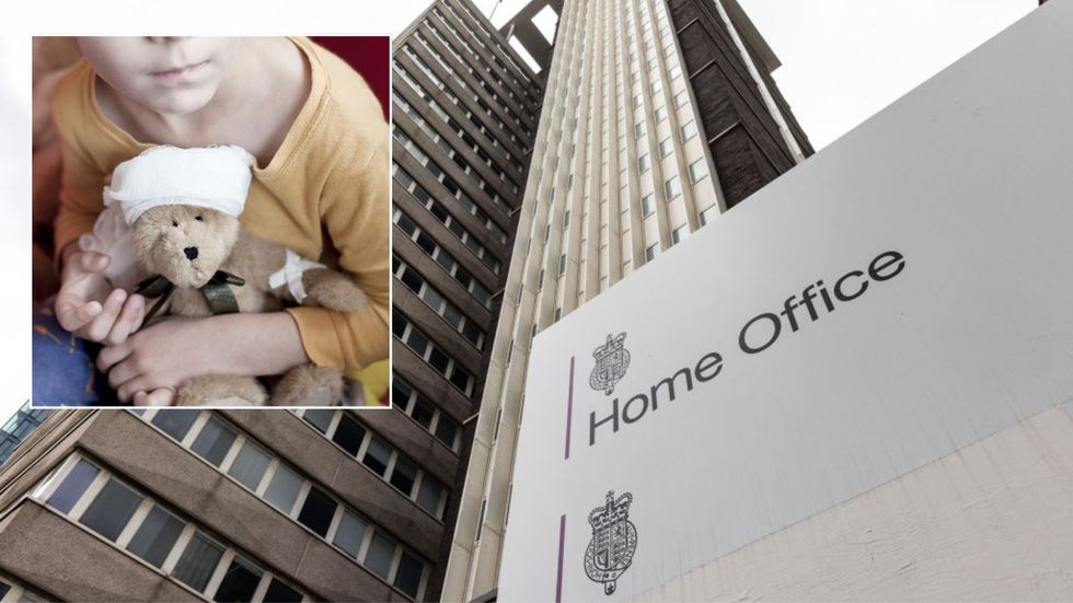 Home Office and boy cuddling a teddy