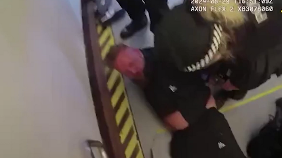 Howarth was dragged to the floor by officers