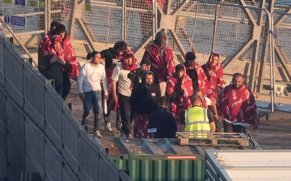 Image of people believed to be migrants being brought to Dover by an RNLI lifeboat