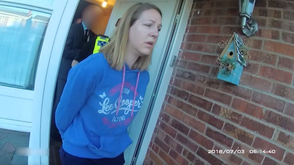 In this frame from a police body-camera video provided by Cheshire Constabulary, Lucy Letby is arrested on July 3, 2018