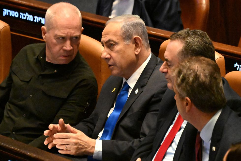 Israeli Prime Minister Benjamin Netanyahu speaks to Defense Minister Yoav Gallant