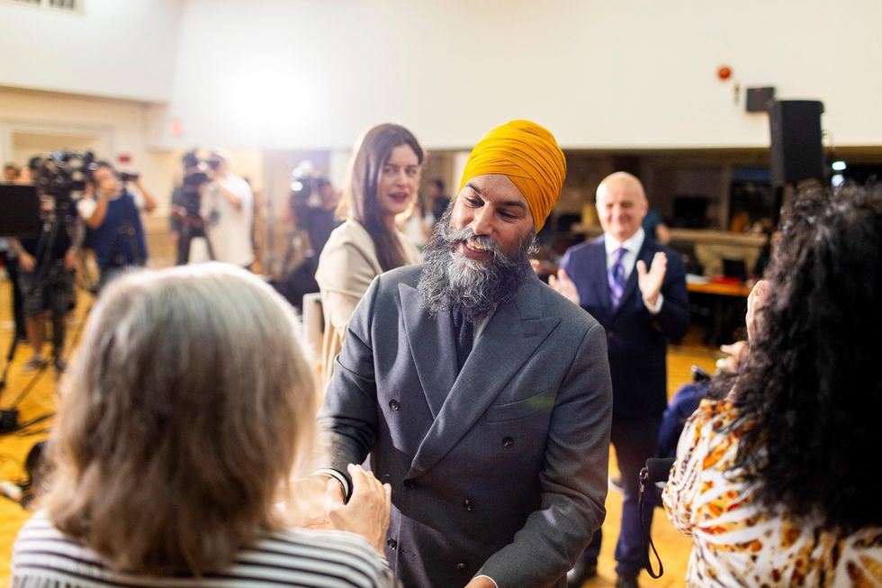 Jagmeet Singh, leader of the left-leaning opposition New Democrats, greets supporters