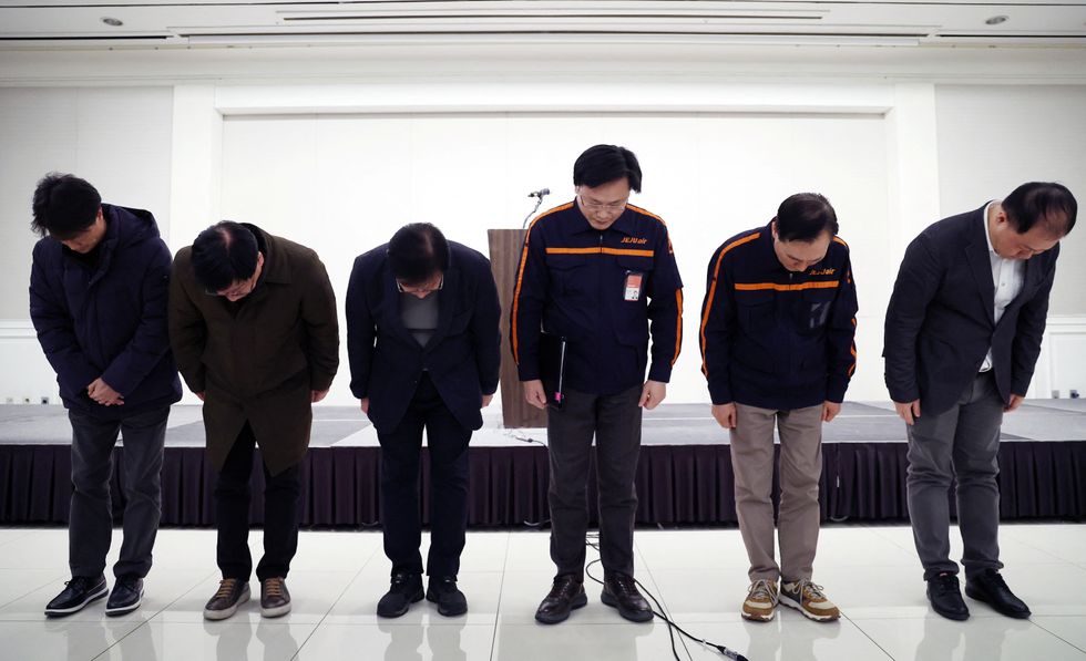 Jeju Air CEO Kim E-bae and officials bow to apologise for their plane's incident at Muan International Airport