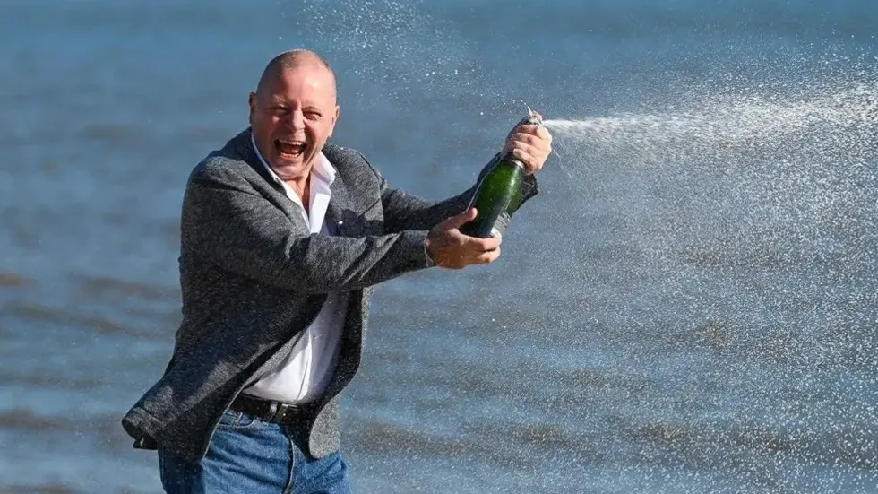 John Lingard celebrates on Gorleston beach