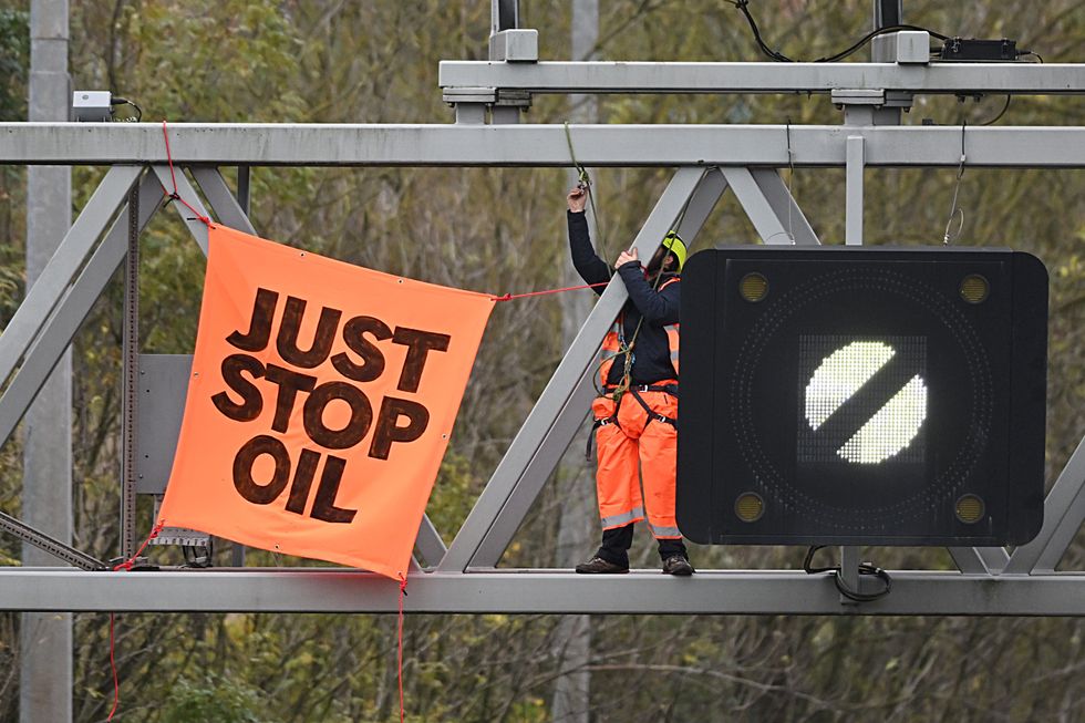 Just Stop Oil activists smile and blow kisses as they're jailed for protesting on M25