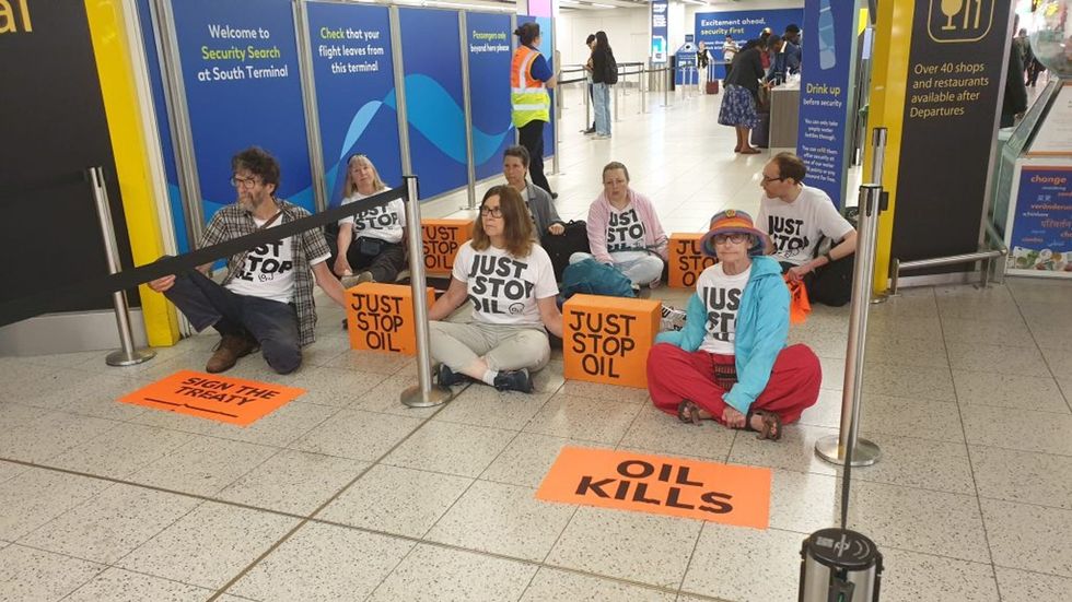 Just Stop Oil activists spark major delays as they block departure gates at Gatwick Airport