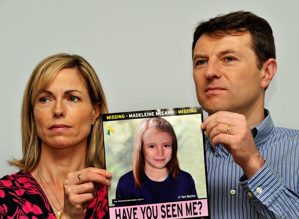 Kate and Gerry McCann holding aged-up photo of Madeleine