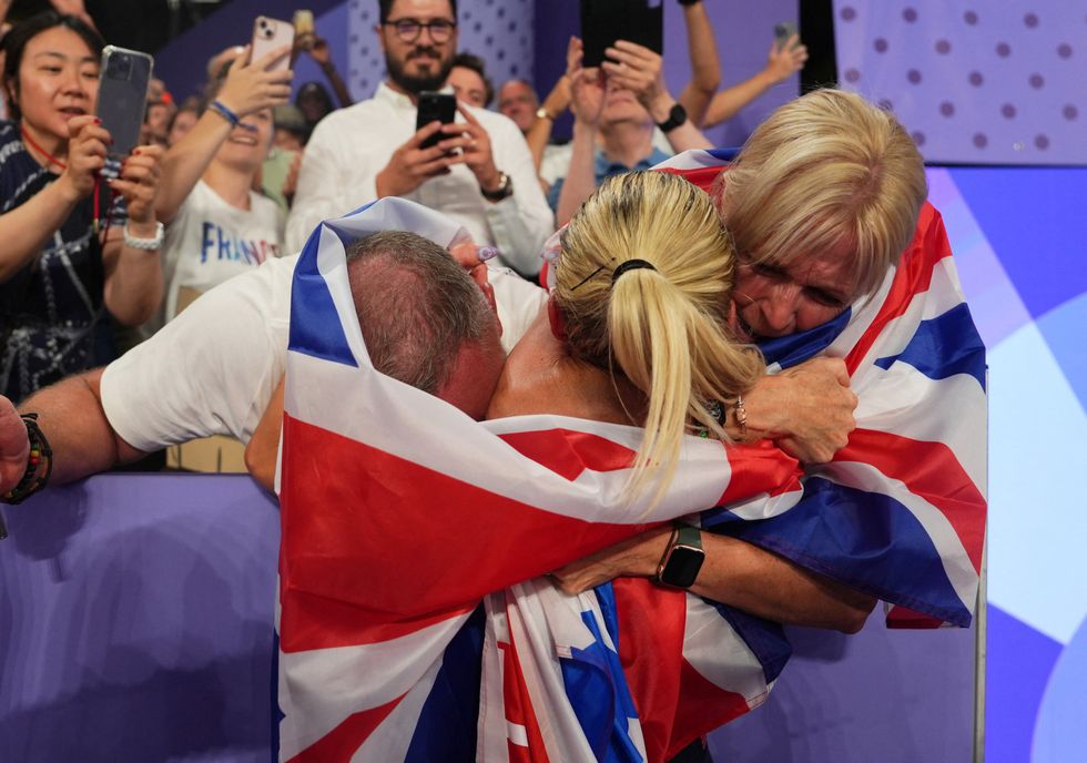 Keely Hodgkinson embraced her family after the race