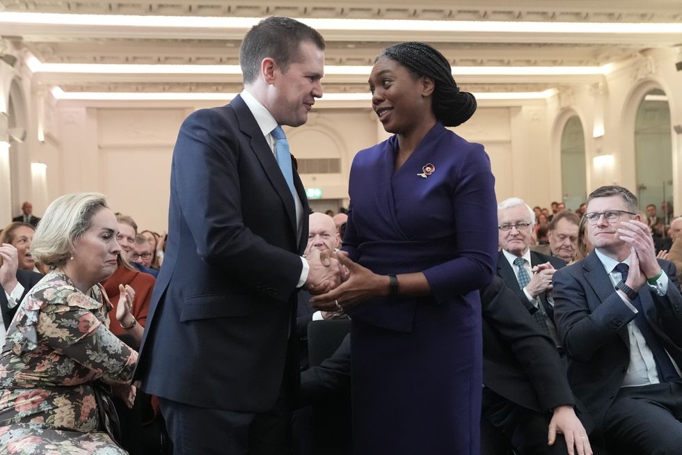 Kemi Badenoch is congratulated by Robert Jenrick