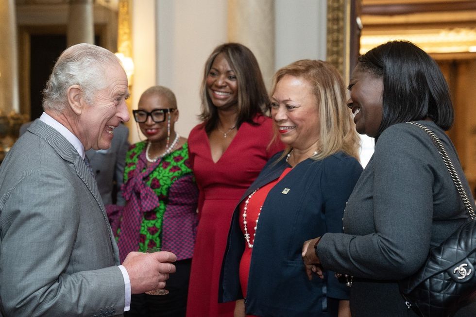 King Charles beams as he mingles with guests at special royal reception