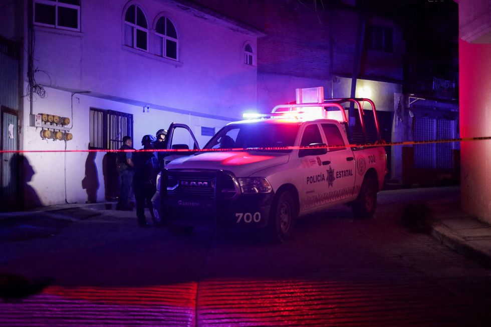 Law enforcement and police car at Arcos's residence