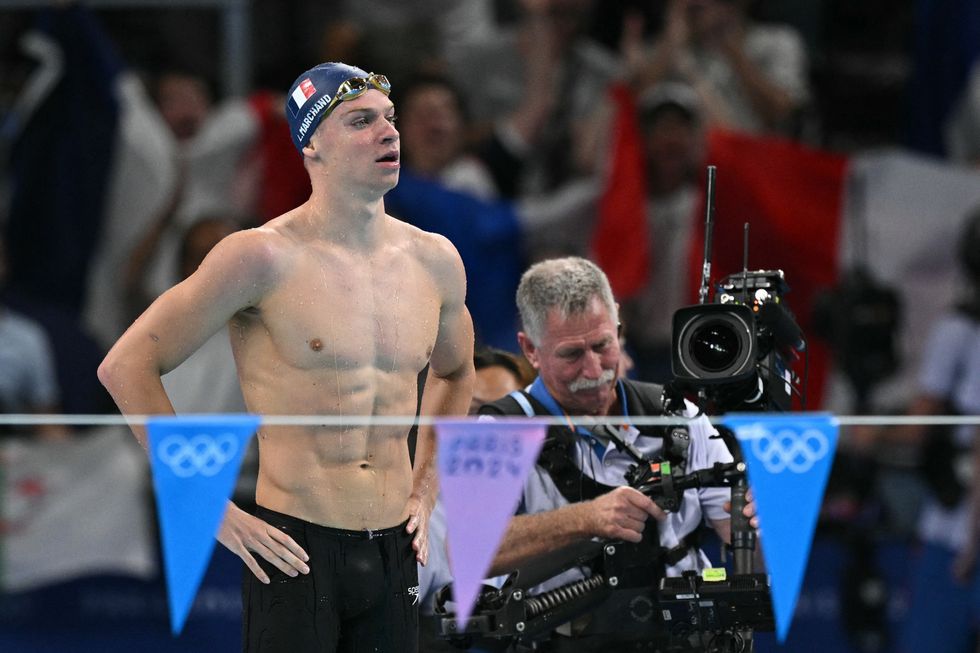 Leon Marchand won gold with an Olympic record time