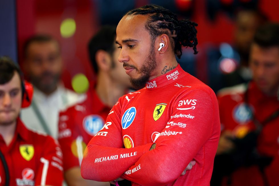 Lewis Hamilton of Great Britain and Scuderia Ferrari looks on in the garage prior to practice ahead of the F1 Grand Prix of Australia at Albert Park Grand Prix Circuit on March 14, 2025 in Melbourne, Australia