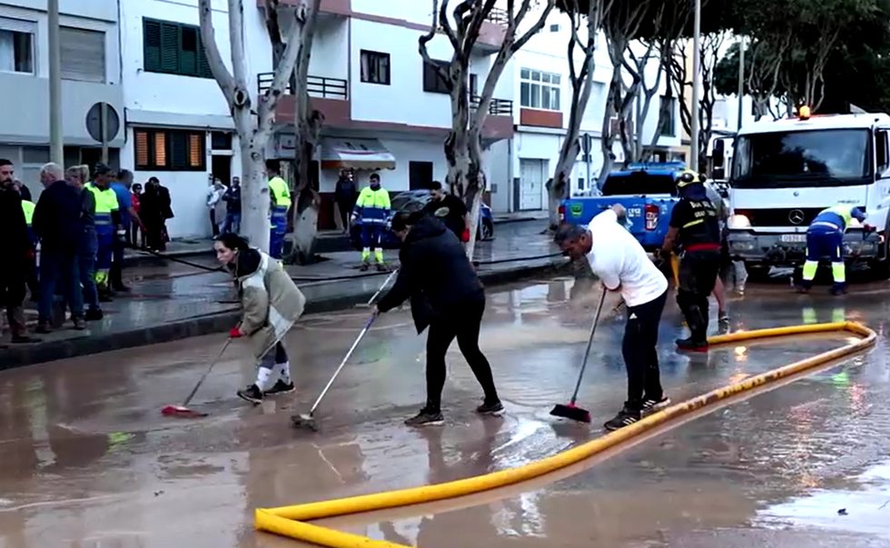 Locals cleaning streets