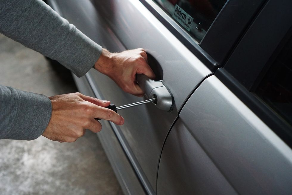 Man breaking into a car