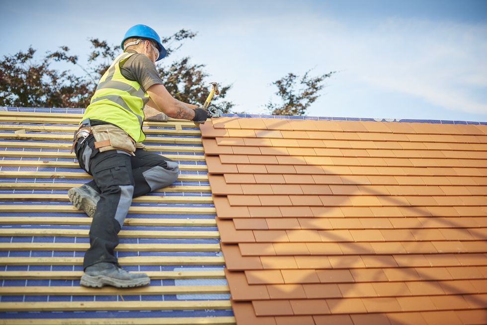 Man fixing roof