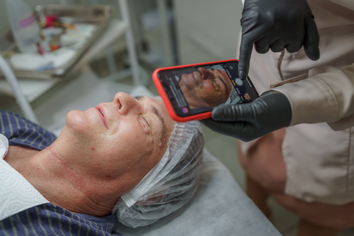 Man getting his face examined 