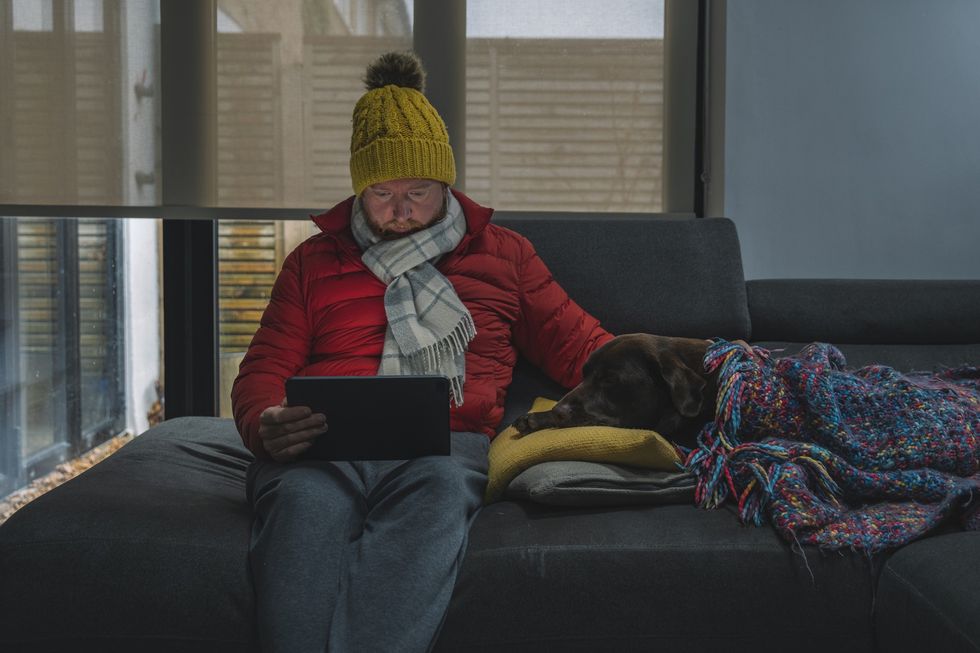 Man in house without heating on