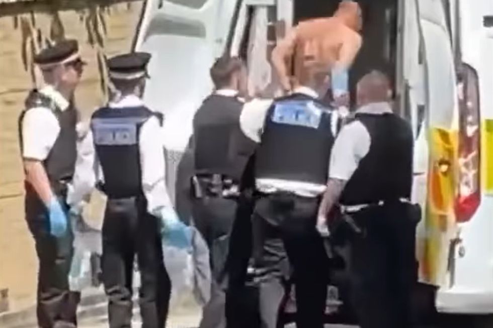 Man loaded into back of police van after allegedly damaging Lee Rigby memorial