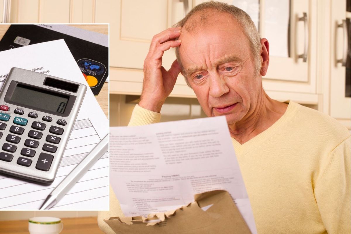 Man looking at letter and calculator 