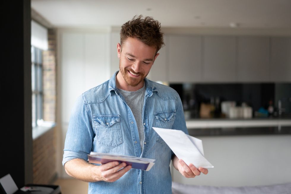 Man looking at letters