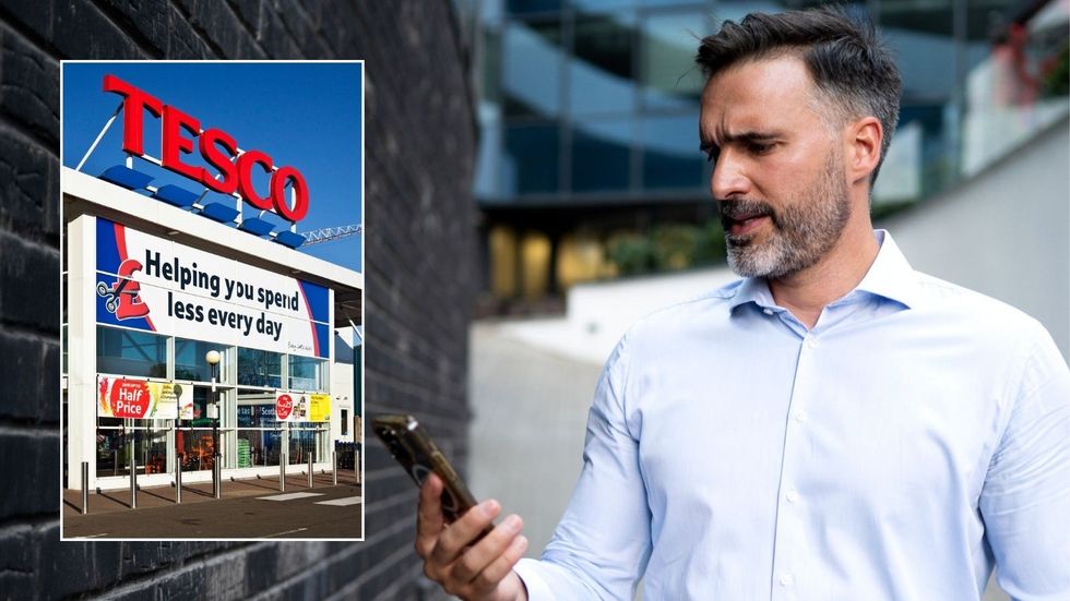 Man looking at phone and Tesco store