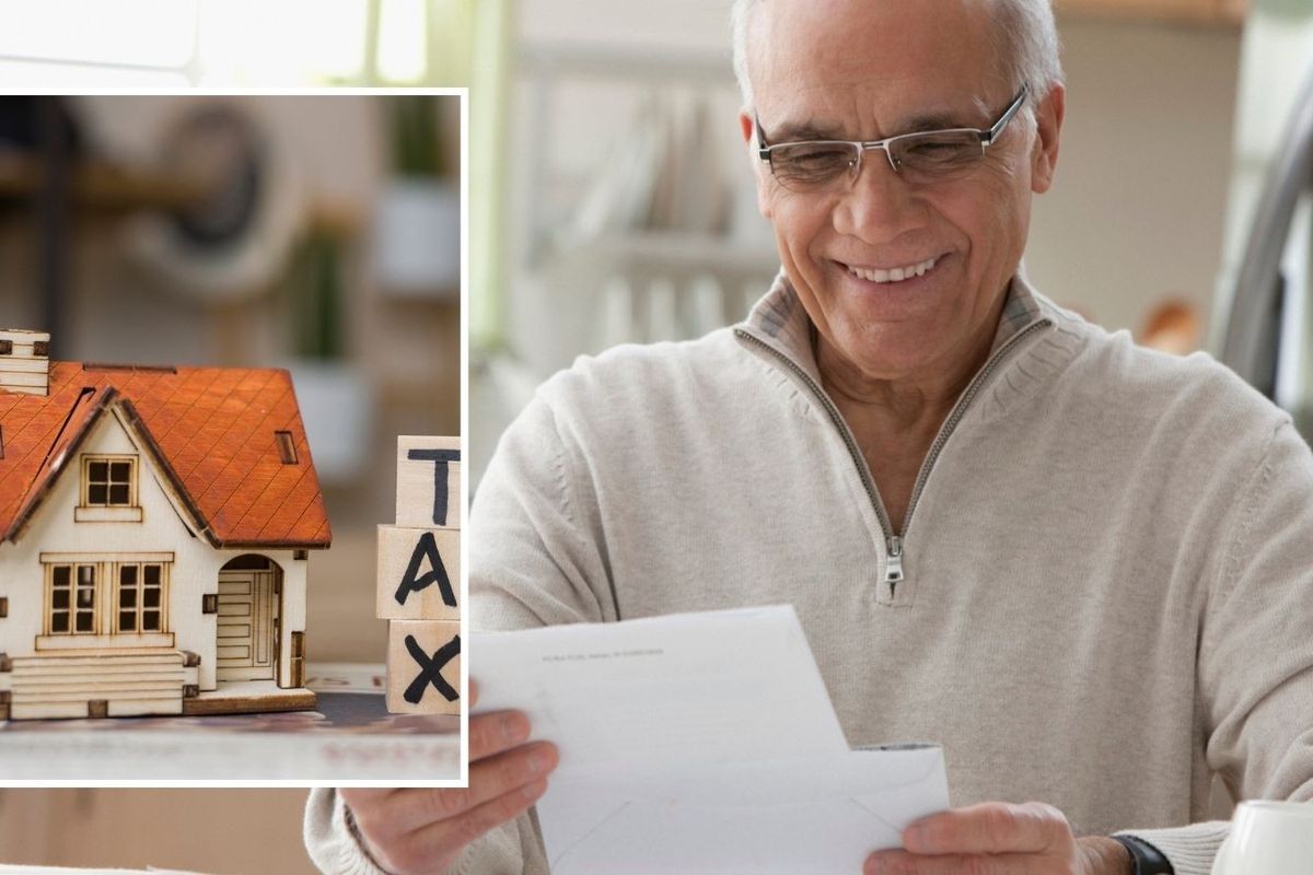 Man looking happy at financial statement and tax sign