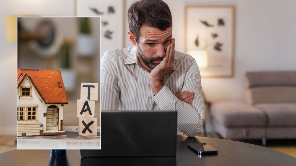 Man looking worried and tax sign