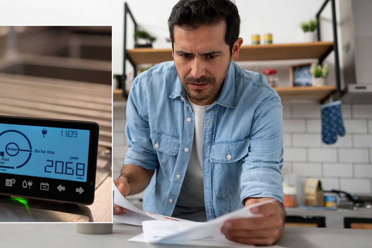 Man looking worried at letter and smart meter 
