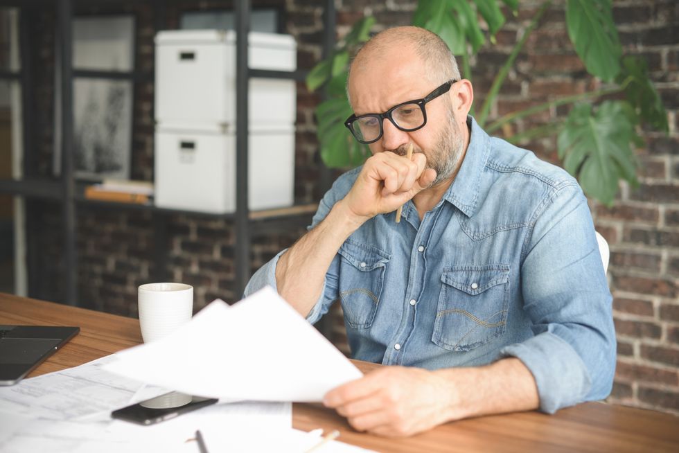 Man looks worried about tax letter