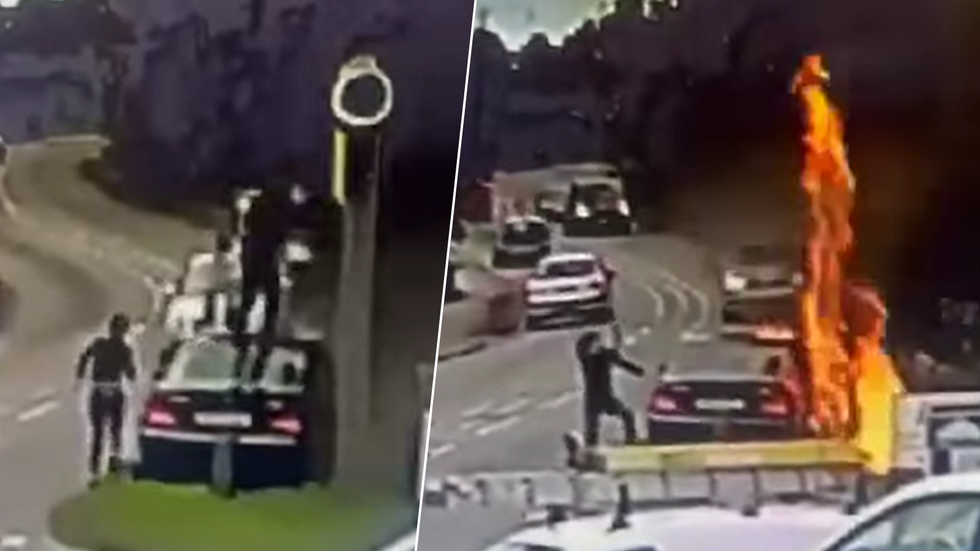 Man on car setting fire to speed camera