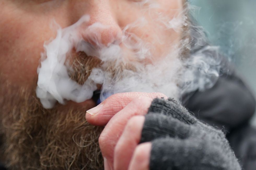 Man smoking disposable vape