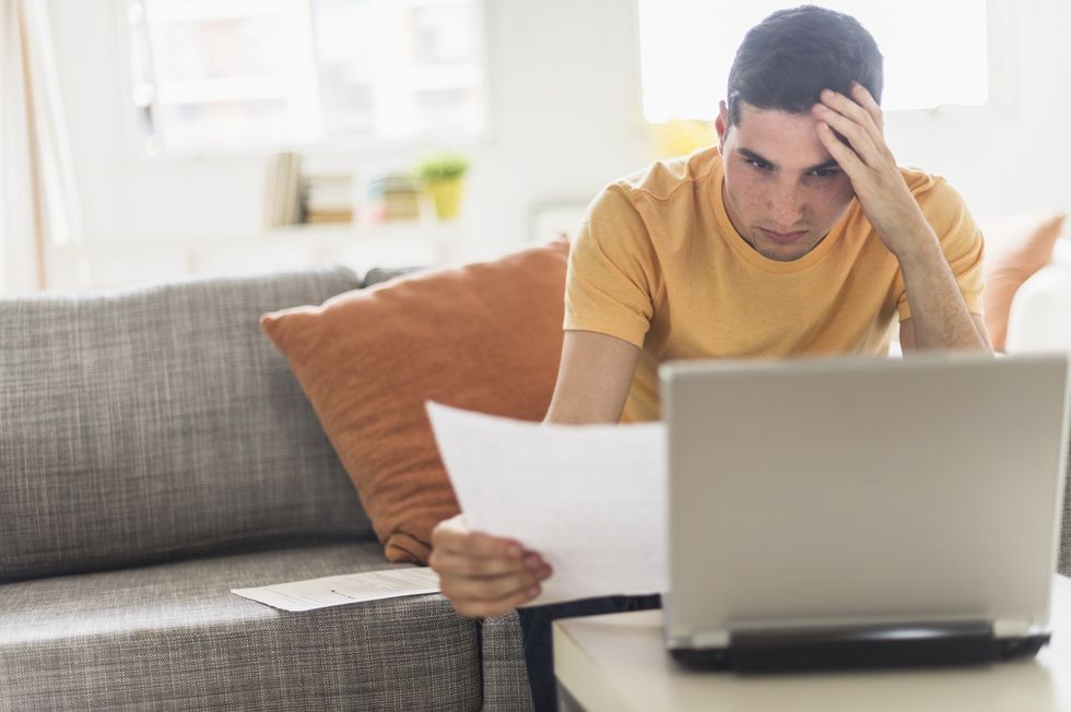 Man worried looking at bills