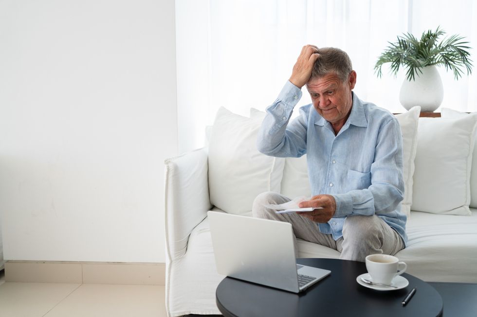 Man worried looking at finances