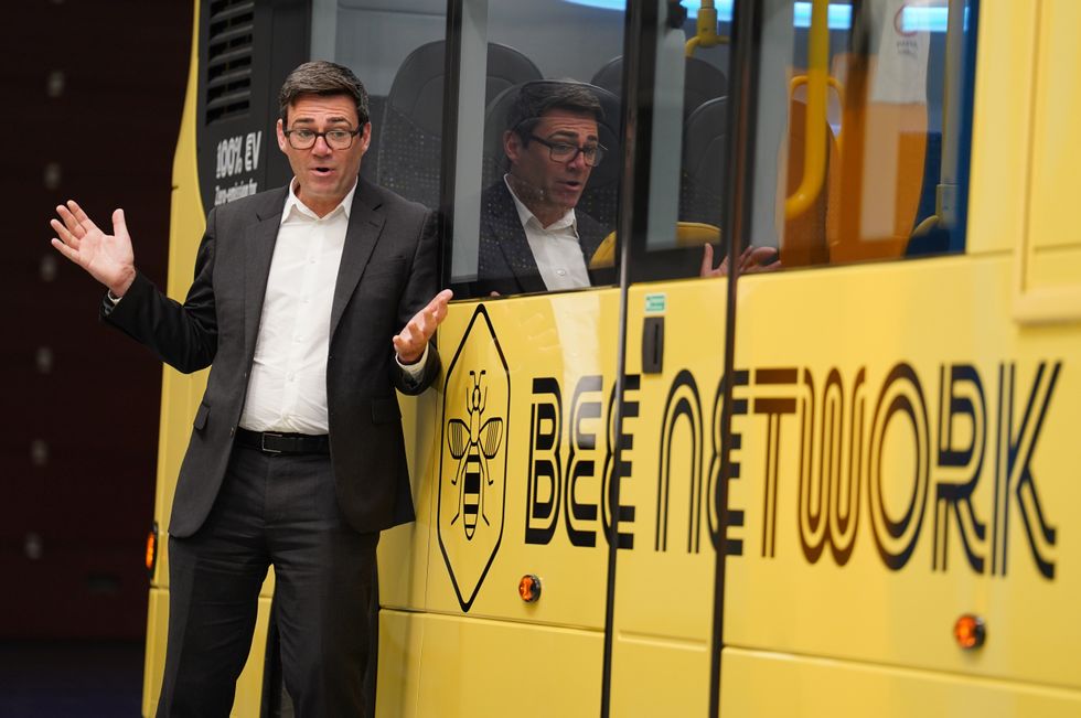 Manchester Mayor Andy Burnham with a Bee Network bus