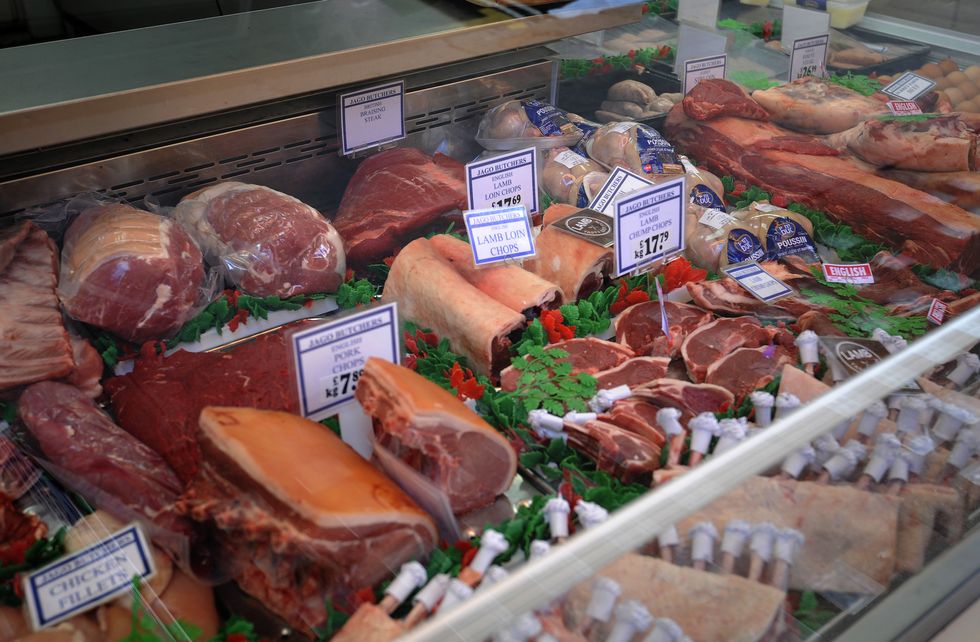 Meat is displayed in a shop window