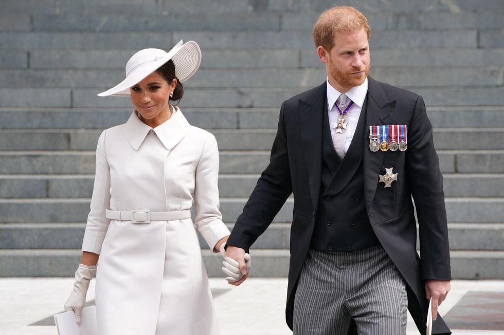 Meghan Markle and Prince Harry holding hands