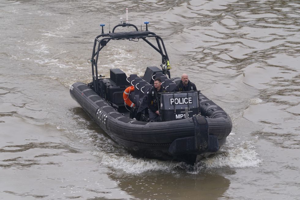 Members of the Metropolitan Police Marine Policing Unit near to Chelsea Bridge