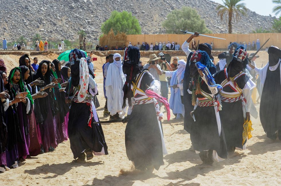 Men and women perform a traditional dance during the Sebeiba Festival in Djanet