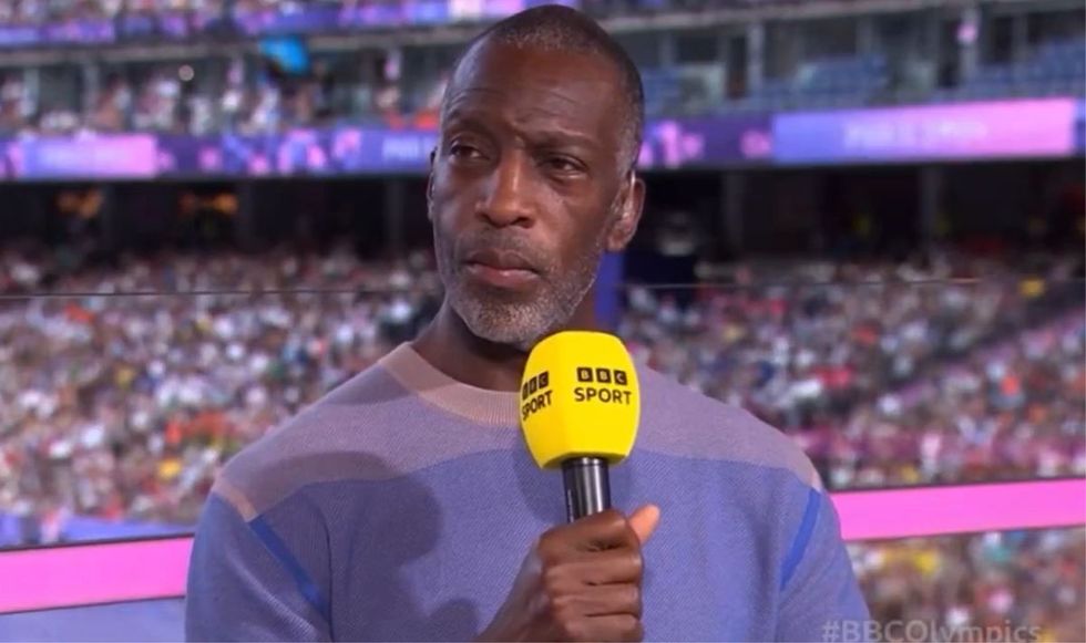 Michael Johnson was on the edge of his seat watching the 1,500m final