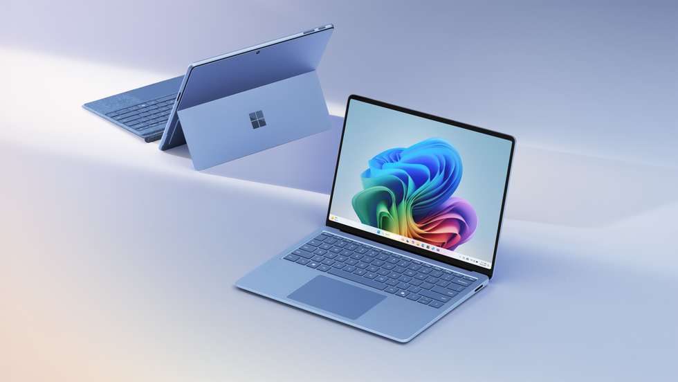 microsoft surface pro and Surface Laptop 7th Edition pictured in new blue colour on a plain background running the latest AI Copilot features on Windows 11 