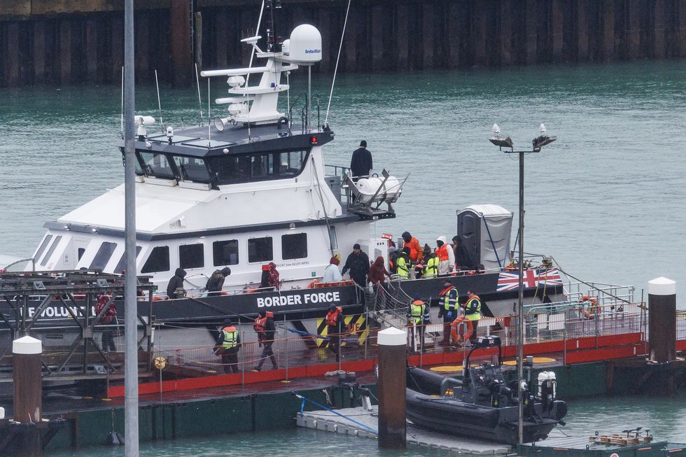 Migrants are brought ashore after being picked up in the English Channel by a Border Force vessel on November 16, 2023