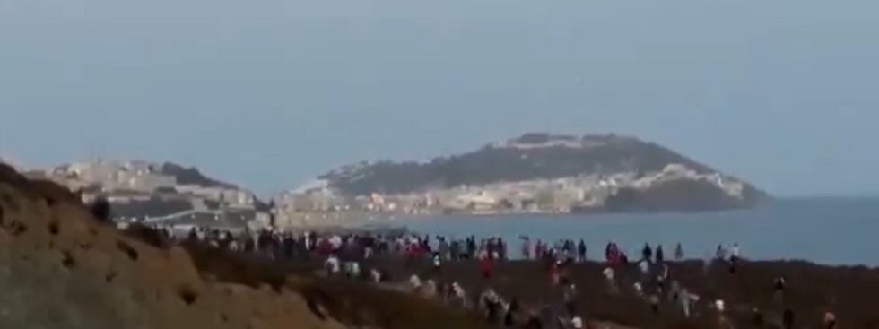 Migrants attempting to cross into the Spanish enclave on Sunday