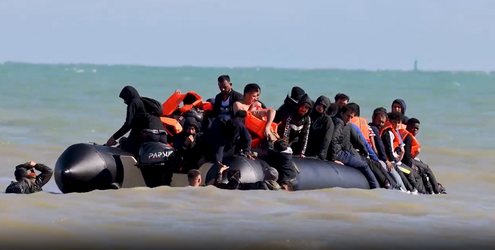 Migrants crossing small boat