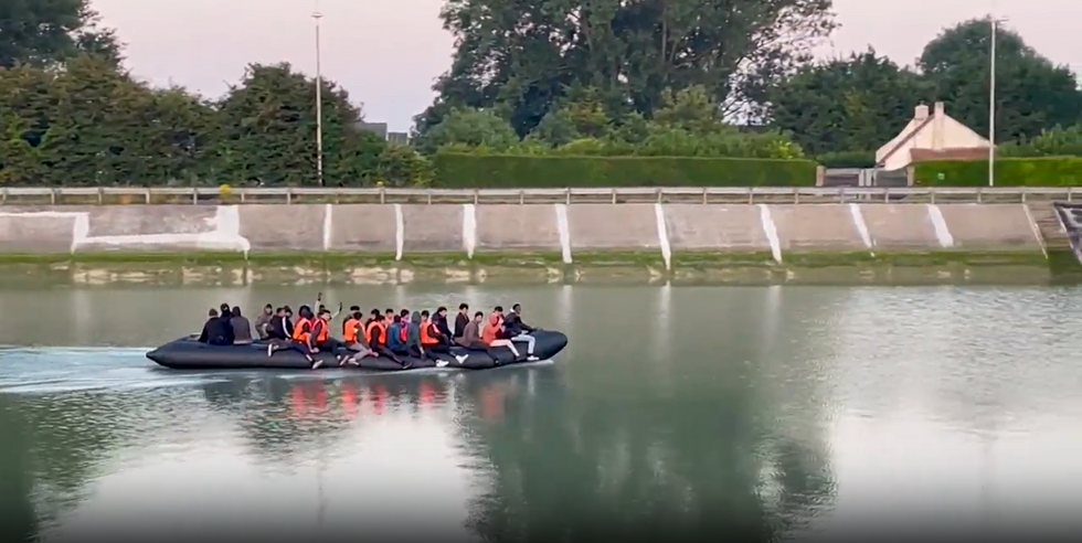 Migrants crossing small boat