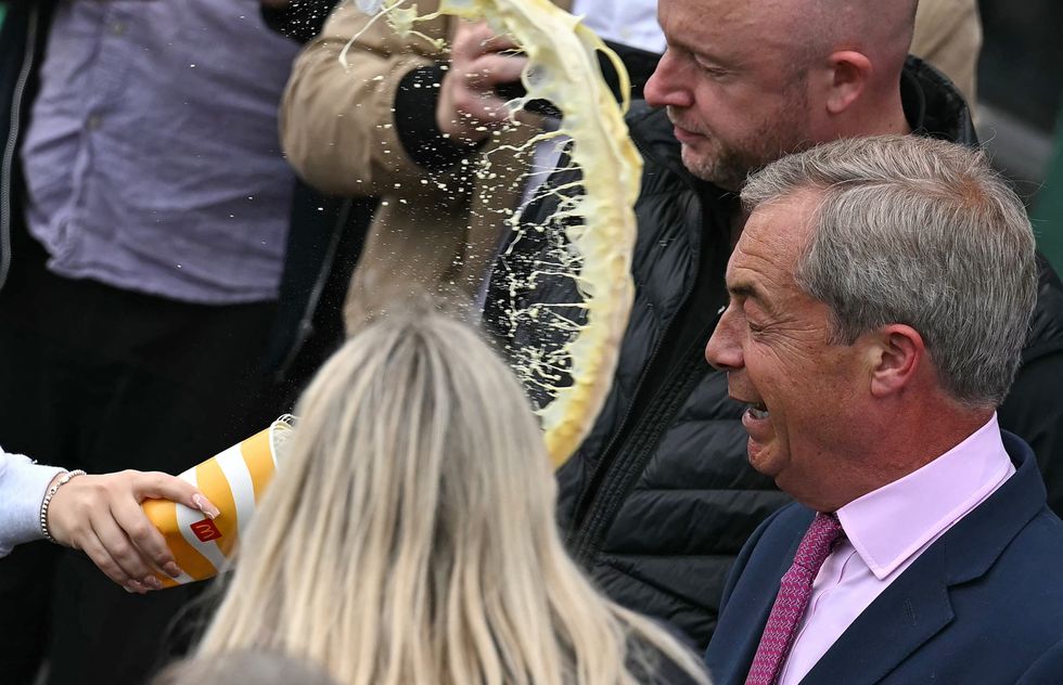 Milkshake is tossed over Nigel Farage