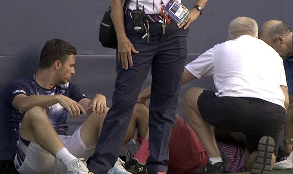 Miomir Kecmanovic went to sit down by Yoshihito Nishioka's side