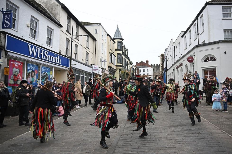 Morris dancers perform in the streets in the centre of Chepstow on the Welsh/English border