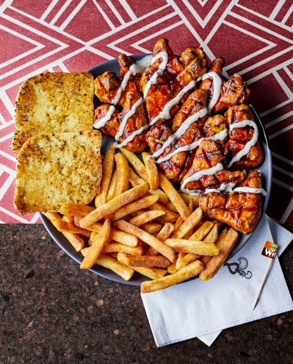 Nando's chips, garlic bread and chicken wings