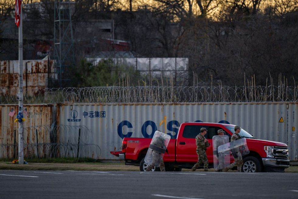 National Guard soldiers carry shields in preparation to be stationed on the banks of the Rio Grande river at Shelby Park on January 12, 2024 in Eagle Pass, Texas